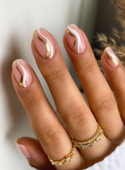 pink and gold swirl spring summer nail design.